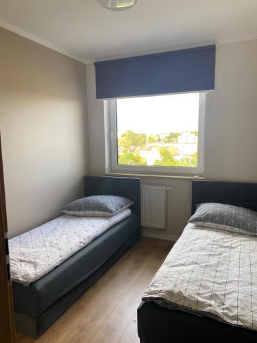 Postel nebo postele na pokoji v ubytování Apartament Mazurska