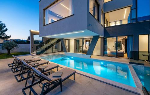 an image of a house with a swimming pool at Nice Home In Pula With Sauna in Pula