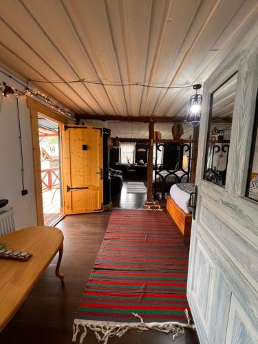 a room with a bed and a rug on the floor at Hnameni Bovadzor Lodge in Maksim Gorʼkiy