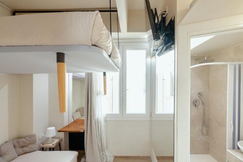 a bedroom with a bunk bed and a bathroom at Duomo - Camere matrimoniali con bagno privato in Florence