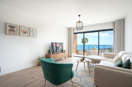 a living room with a view of the ocean at Hygge Madeira by LovelyStay in Caniço