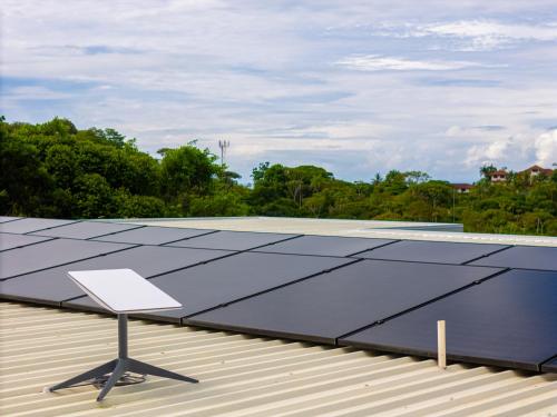 a solar array on the roof of a house at New! Modern-luxury-3 Suites-pool-ojochal-100mbps in Ojochal