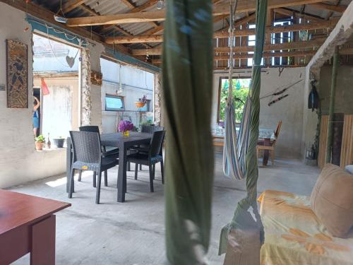 a dining room with a table and chairs in a room at Vera's Home in Anaklia