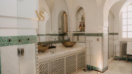 a bathroom with two sinks in a room at Villa Soraya Lodge & Spa in Rabat
