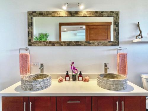 two sinks in a bathroom with a mirror at 3 Suites-views-great Pool-near Dominical-luxury in Laguna