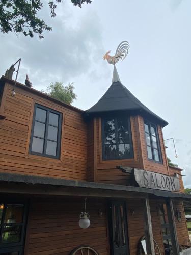 a building with a bird on the top of it at Klondike City in Vojens