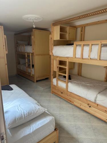 Postel nebo postele na pokoji v ubytování Dar Imim Surf House