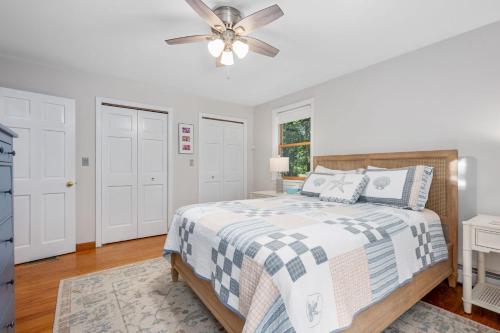 a bedroom with a bed and a ceiling fan at 4 Harvest Hollow Harwich Port Cape Cod- - We Shall Sea in Harwich Port