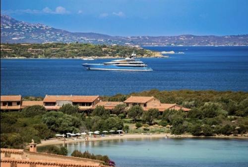 a cruise ship in a large body of water at Studio In The Gulf of Marinella in Marinella