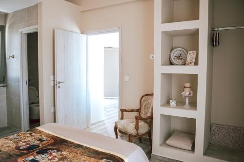 a bedroom with a bed and a walk in shower at ReLux Villa in Kefallonia