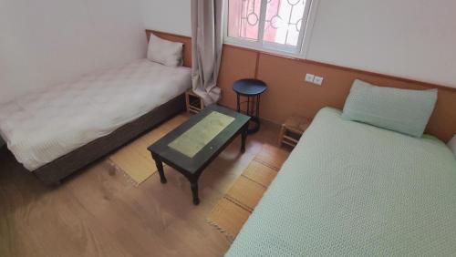 Postel nebo postele na pokoji v ubytování FAKHARA Hostel
