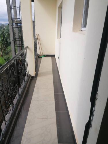 a hallway of a building with a balcony at résidence rosalie in Kofa