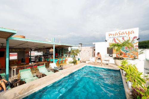 a swimming pool on the roof of a building at Masaya Santa Marta in Santa Marta
