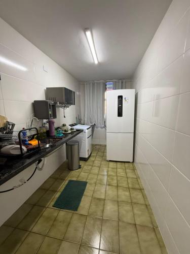 Η κουζίνα ή μικρή κουζίνα στο Quarto aconchegante e silencioso centro