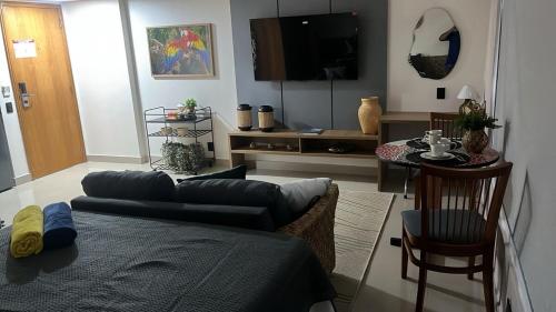 a living room with a couch and a table at Tropical Business Apto 614 in Manaus