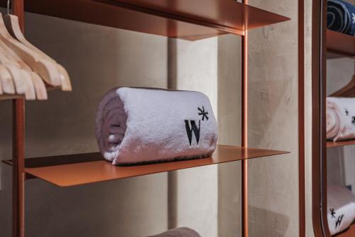 a towel on a shelf in a closet at Kuuna Luxury Stays by Wynwood House in Medellín