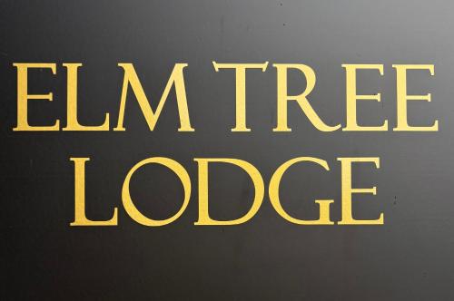 a yellow sign that says lemon tree lodge at Elm Tree Lodge in Keswick