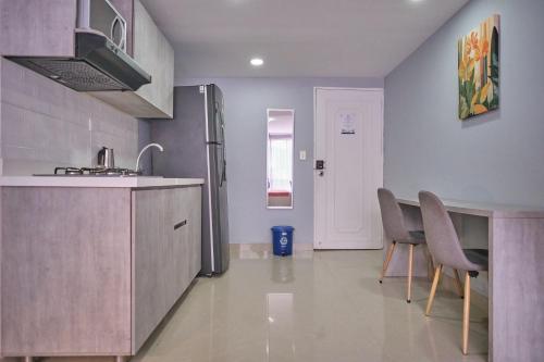 Η κουζίνα ή μικρή κουζίνα στο Apartamentos y Loft Laureles