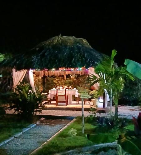 a house with a table and aentedented at Villa KAMBUSA appartamento SOFIA in Las Galeras