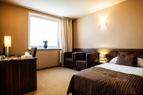 Ένα ή περισσότερα κρεβάτια σε δωμάτιο στο Hotel Comfort with free Wellness and Fitness Centrum