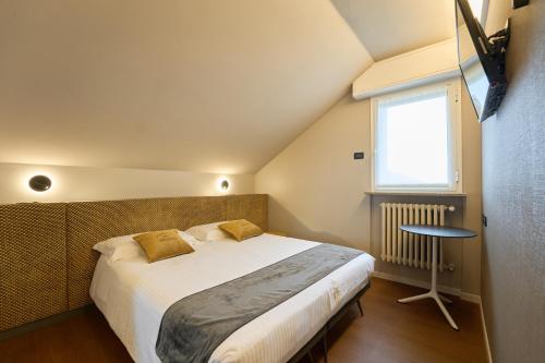 Katil atau katil-katil dalam bilik di Albergo Moderno & Spa