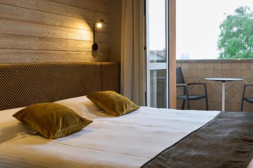 Katil atau katil-katil dalam bilik di Albergo Moderno & Spa