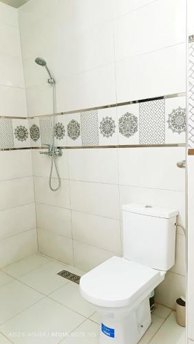 a bathroom with a toilet and a shower at Aziz House 1 in Tan-Tan