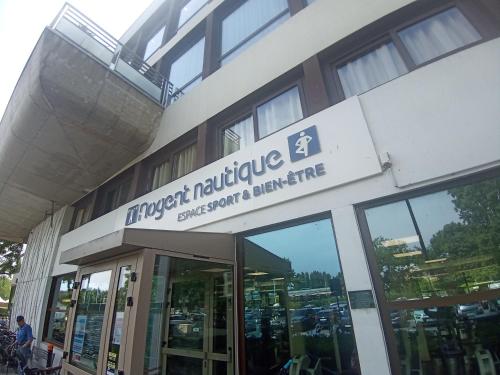 a building with a sign on the side of it at Escapade entre Ville et Rivière in Nogent-sur-Marne