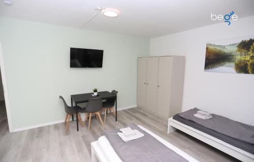 Μια τηλεόραση ή/και κέντρο ψυχαγωγίας στο BEGE APARTMENTS ComfyStay