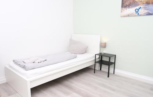 Ένα ή περισσότερα κρεβάτια σε δωμάτιο στο BEGE APARTMENTS ComfyStay