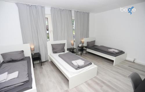 Ένα ή περισσότερα κρεβάτια σε δωμάτιο στο BEGE APARTMENTS ComfyStay