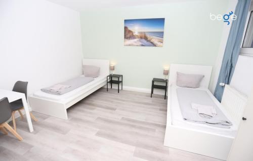 Ένα ή περισσότερα κρεβάτια σε δωμάτιο στο BEGE APARTMENTS ComfyStay