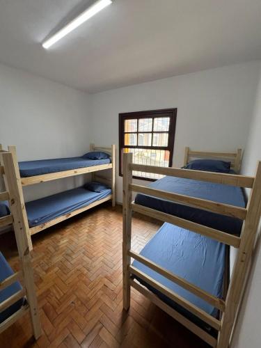 Postel nebo postele na pokoji v ubytování Ana Rosa estação Av Paulista