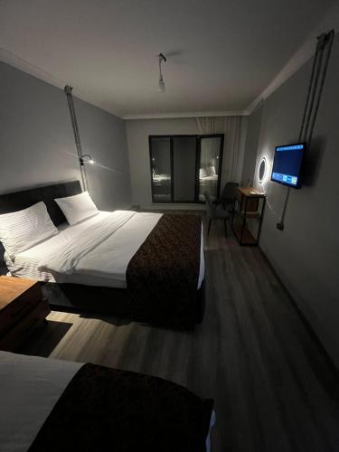Ein Bett oder Betten in einem Zimmer der Unterkunft The iderot Otel Taksim
