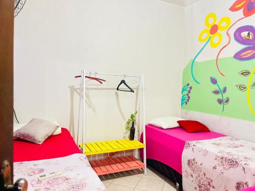Ένα ή περισσότερα κρεβάτια σε δωμάτιο στο Verdes Hostel Palmas-TO