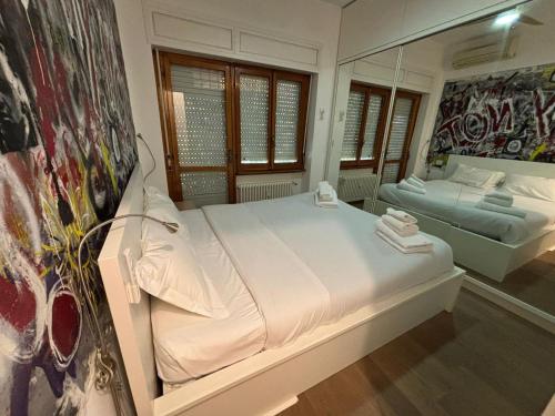 Ένα ή περισσότερα κρεβάτια σε δωμάτιο στο Foscari Cozy House