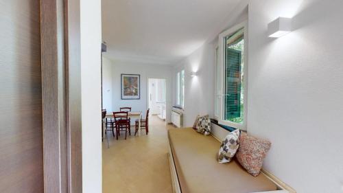 a living room with a couch and a dining room at La Ciliegia in Uscio