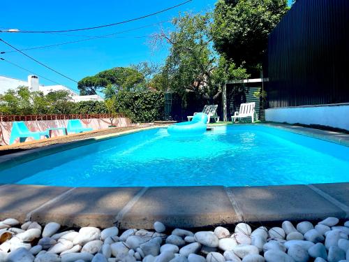 a swimming pool with a toy in the water at Sesimbra Country House with Swimming Pool in Sesimbra