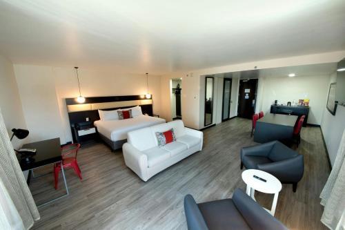 Un ou plusieurs lits dans un hébergement de l'établissement D Sabana Hotel San José