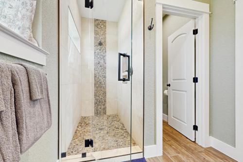 a bathroom with a shower with a glass door at Vacation Station in Canyon Lake