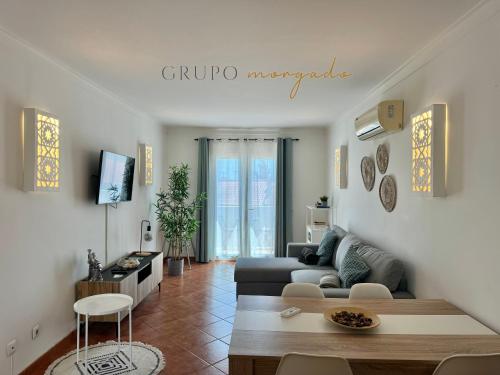 a living room with a couch and a table at Grupo Morgado - Quinta do Morgado - Morgado Privilege in Tavira