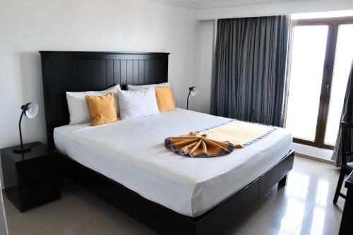Postel nebo postele na pokoji v ubytování Napolitano Hotel