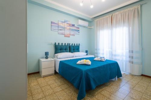 Ένα ή περισσότερα κρεβάτια σε δωμάτιο στο Sole e Luna Apartment