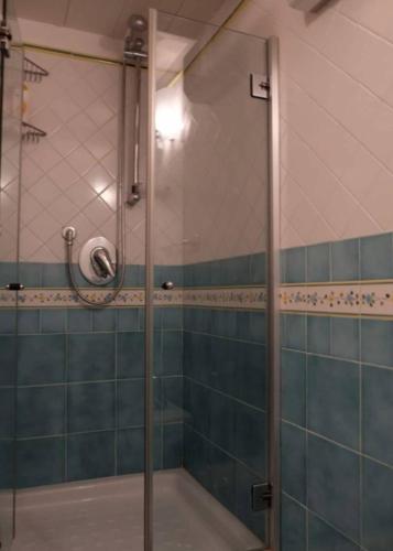 a shower with a glass door in a bathroom at Il Sogno Italiano in Atrani