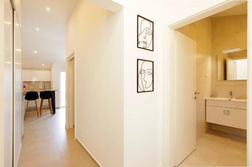 a hallway with a white wall in a house at MaMi in Korčula
