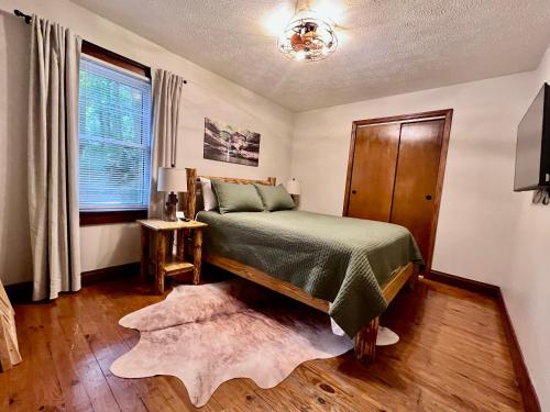 a bedroom with a bed and a window at Mill Haus in South Bloomingville
