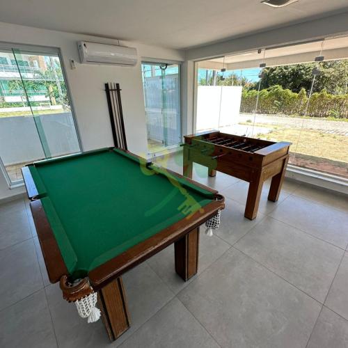 two pool tables in a living room with a pool table at Duplex com Jacuzzi apt 315 Muriu Beach Village in Ceará-Mirim