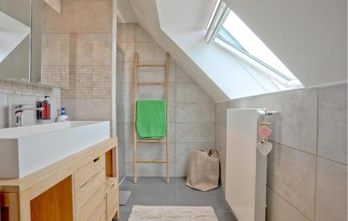 a bathroom with a sink and a ladder at Amazing Home In Creances With Wifi in Créances