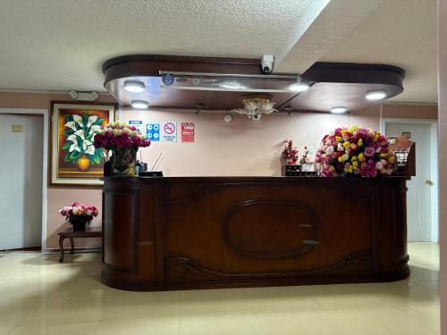 a flower shop with flowers on top of it at Hotel Jarfi in Hacienda El Recreo