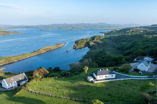 an aerial view of a house and a river at Shoreline Cottage in Rosapenna